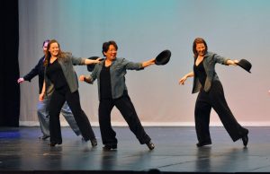 tap dance students performing footwork on stage